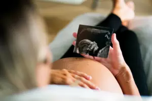 Pregnant woman looking at sonogram